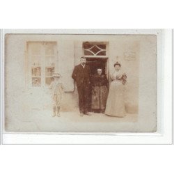 BASTIA - CARTE PHOTO -  Personnages devant leur maison de ville - Photographe: J.Moretti - très bon état