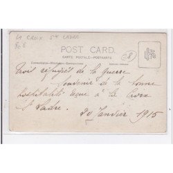 LA CROIX SAINT LADRE : carte photo d'un enfant jouant avec une arme a feu (jouet) - très bon état