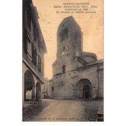 ORLONS-Ste-MARIE : eglise ste-croix construite en 1080 le clocher et vieilles maisons - tres bon etat