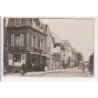 TROUVILLE : carte photo d'une rue avec commerce - route de Pont l'Evêque - très bon état