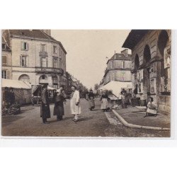 AUNAY SUR ODON : carte photo d'une scène de rue - très bon état